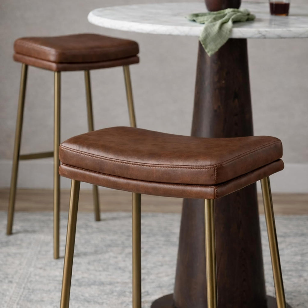Maven Lane Berkley Backless Bar Stool 31 Inch – Saddle Stool with Footrest – Aged Gold Metal Frame & Brown Faux Leather Upholstery – Ideal for Bars, Pubs and Tall Kitchen Counters